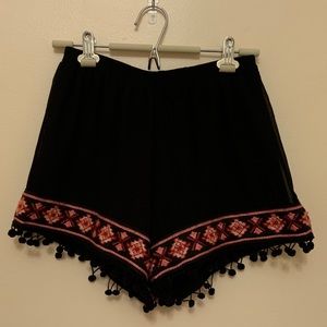 Black pom pom shorts with pink & orange detail